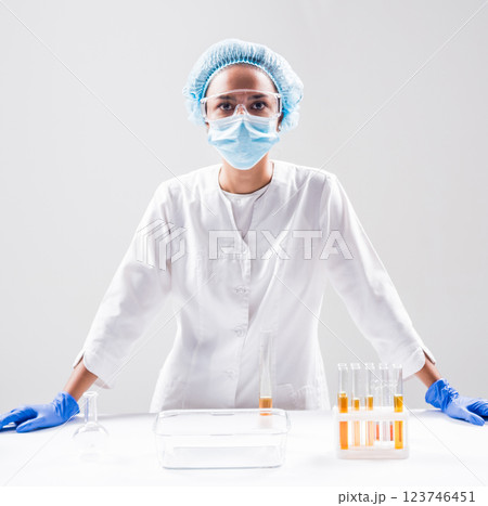 Scientist pouring organic oil. Beauty and cosmetics sciences. Scientist pouring organic oil. Beauty and cosmetics sciences. 123746451