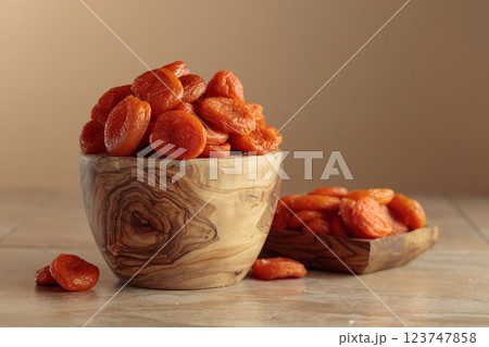 Organic dried apricots on a beige background with copy space. Organic dried apricots on a beige background with copy space. 123747858
