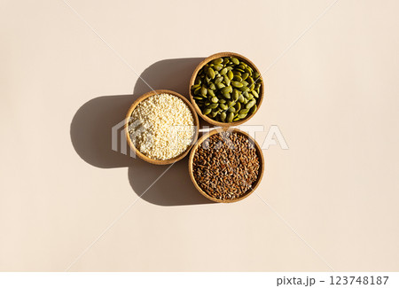 Pumpkin, Flax and Sesame Seeds in Bowls. Organic Superfood Trio. 123748187