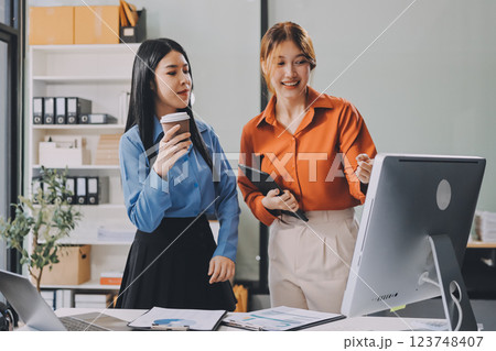 Entrepreneurs and business people conference in modern meeting room, happy multiracial coworkers have fun cooperating working together at office meeting, asian teamwork concept 123748407