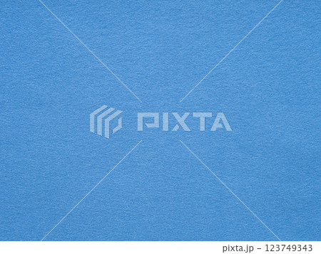 A serene expanse of rich azure, this textured felt surface evokes a sense of calm and simplicity 123749343