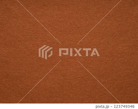 The rustic russet surface of this felt fabric whispers tales of autumn warmth and artisanal charm The rustic russet surface of this felt fabric whispers tales of autumn warmth and artisanal charm 123749346