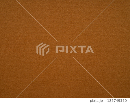 A warm russet felt texture speaks of cozy autumn evenings and the rich patina of well-loved leather 123749350