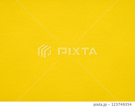 The vibrant canary yellow felt radiates energy, offering a vivid backdrop full of cheerful and creative potential The vibrant canary yellow felt radiates energy, offering a vivid backdrop full of cheerful and creative potential 123749354