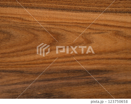 Rich, textured santos rosewood or palisander wooden surface showcasing natural patterns and warm tones 123750658