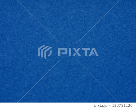 Vivid cobalt blue floods the paper's texture, igniting a sense of boldness and vibrant energy 123751120