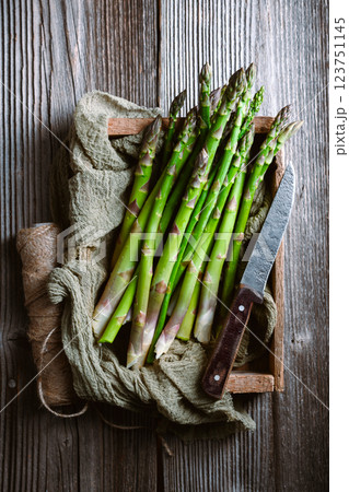 Just picked green asparagus sprouts in a wooden box 123751145