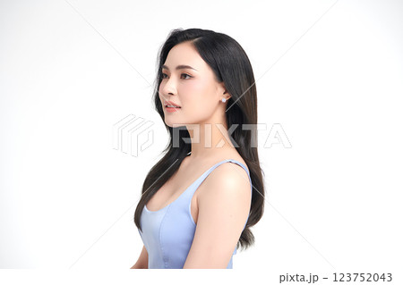 A beautiful young Asian woman with clean, fresh skin against a white background. She represents beauty, skincare, and spa treatments. A beautiful young Asian woman with clean, fresh skin against a white background. She represents beauty, skincare, and spa treatments. 123752043