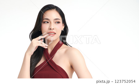 A beautiful young Asian woman with clean, fresh skin against a white background. She represents beauty, skincare, and spa treatments. A beautiful young Asian woman with clean, fresh skin against a white background. She represents beauty, skincare, and spa treatments. 123752054