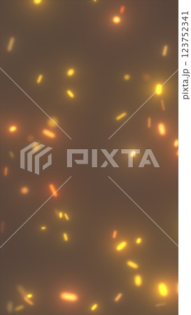 Abstract background with glowing orange and yellow particles resembling sparks or embers. Warm-toned, blurred effect creating a soft glowing atmosphere 123752341