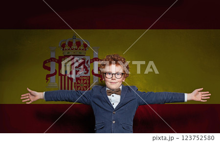 Portrait of schoolboy child on Spanish flag background. Education and childhood in Spain concept Portrait of schoolboy child on Spanish flag background. Education and childhood in Spain concept 123752580