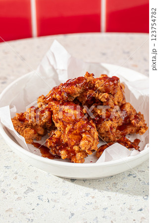 Crispy fried chicken thighs with red sauce Crispy fried chicken thighs with red sauce 123754782