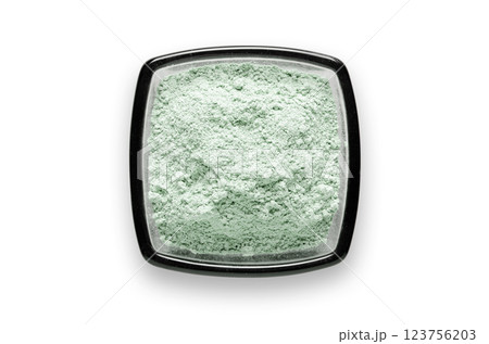 Cosmetic clay for a face mask in a bowl. Isolated on a white background. Cosmetic clay for a face mask in a bowl. Isolated on a white background. 123756203