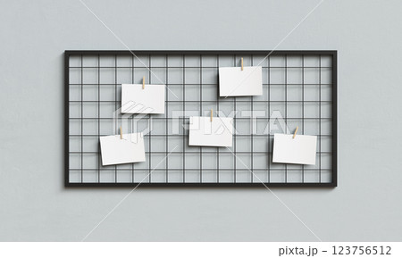 Blank Paper Hanging on Metal Grid Board with Wooden Clip Mock up. 3D Rendering 123756512