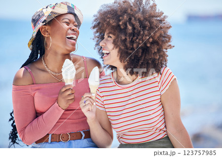 Beach, ice cream and friends on holiday laughing at a funny joke while bonding, happy and relaxing with freedom outdoors. Smile, happiness and young girls eating icecream at sea for a summer vacation Beach, ice cream and friends on holiday laughing at a funny joke while bonding, happy and relaxing with freedom outdoors. Smile, happiness and young girls eating icecream at sea for a summer vacation 123757985