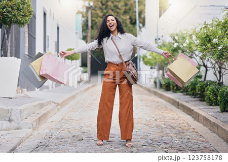 Woman customer, in street and with shopping bags celebrate sale from store, shopping and happy with purchase. Female consumer, confident client and excited outdoor, discount items and retail therapy. Woman customer, in street and with shopping bags celebrate sale from store, shopping and happy with purchase. Female consumer, confident client and excited outdoor, discount items and retail therapy. 123758178
