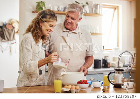 Kitchen, cooking and senior couple with healthy breakfast for juice for vitamin c, nutrition or wellness with support, love and care. Elderly retirement or pension people making morning food together Kitchen, cooking and senior couple with healthy breakfast for juice for vitamin c, nutrition or wellness with support, love and care. Elderly retirement or pension people making morning food together 123758207