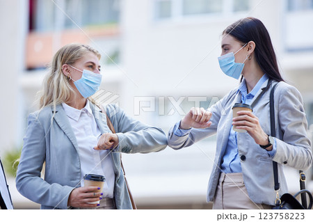 Covid, healthcare and elbow greeting with business people in the morning for social distancing, communication and contact. Partnership, friends and new handshake with women working in global pandemic 123758223