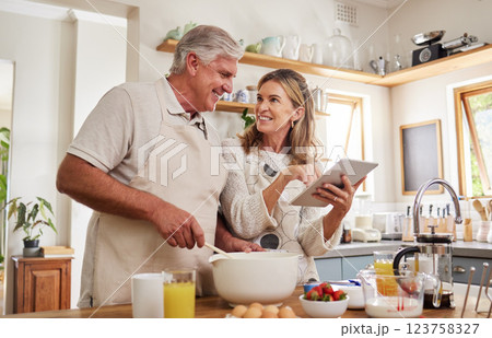 Cooking, tablet and senior couple with video for breakfast food on the internet in the kitchen of their house. Elderly man and woman talking about digital recipe on technology for lunch in their home Cooking, tablet and senior couple with video for breakfast food on the internet in the kitchen of their house. Elderly man and woman talking about digital recipe on technology for lunch in their home 123758327