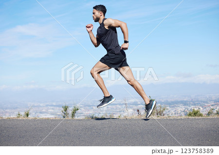 Man running in road, fitness training and run for cardio, health and wellness for healthy lifestyle. Young runner, endurance and sport motivation, fast and fit athlete and exercise journey. Man running in road, fitness training and run for cardio, health and wellness for healthy lifestyle. Young runner, endurance and sport motivation, fast and fit athlete and exercise journey. 123758389