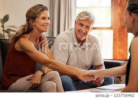 Senior couple, handshake and finance worker welcome, thank you or agreement with consulting with money or retirement savings. Advisor planning funeral insurance, cash growth or investment with client 123758462