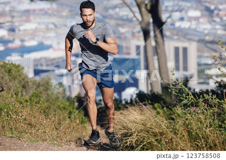 Man is running, fitness and exercise workout for cardio, health and wellness journey in nature outdoors. Young runner, determined and motivation for sports training and healthy lifestyle. Man is running, fitness and exercise workout for cardio, health and wellness journey in nature outdoors. Young runner, determined and motivation for sports training and healthy lifestyle. 123758508