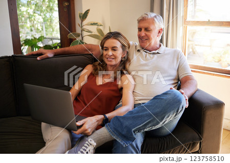 Movie, laptop and senior couple streaming a show on the internet on the living room sofa of their house. Happy, relax and elderly man and woman reading the news on the web with technology on couch Movie, laptop and senior couple streaming a show on the internet on the living room sofa of their house. Happy, relax and elderly man and woman reading the news on the web with technology on couch 123758510
