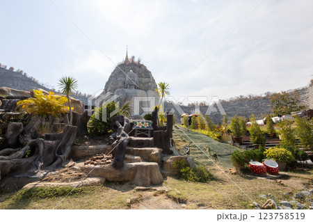 Buddha statue carved from a cliff, Suphanburi Province Buddha statue carved from a cliff, Suphanburi Province 123758519