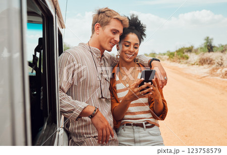 Car, phone and couple on a road trip in summer on holiday to enjoy traveling and sharing social media news. Nature, interracial and happy woman searching on gps map with calm partner on a vacation 123758579