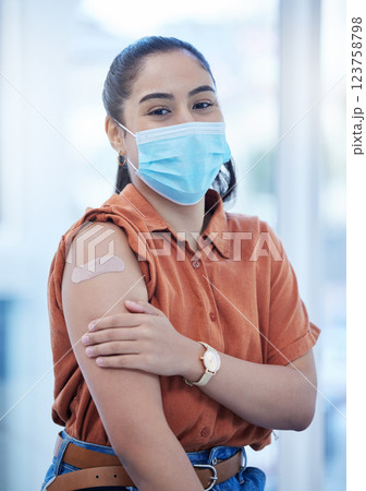 Covid, vaccine and health with woman and for medical safety, wellness and virus protection. Medicine, patient and face mask with girl and adhesive bandage on arm for injection, pandemic and treatment Covid, vaccine and health with woman and for medical safety, wellness and virus protection. Medicine, patient and face mask with girl and adhesive bandage on arm for injection, pandemic and treatment 123758798