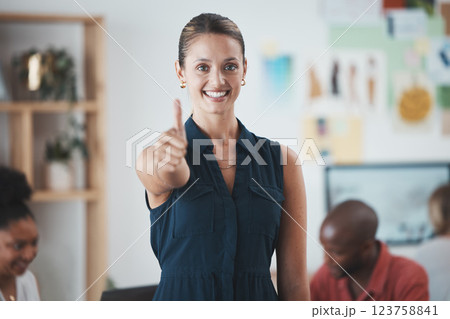 Thumbs up, success and portrait of a happy woman in the office standing in a meeting with her team. Happy, smile and business manager from Mexico with agreement gesture or hand sign in the workplace. 123758841