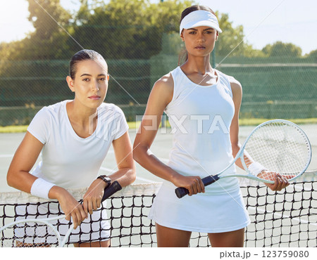 Tennis focus, serious women and woman athlete ready for competitive double game. Portrait of fitness and sports exercise workout of sport duo on outdoor court to start health cardio training Tennis focus, serious women and woman athlete ready for competitive double game. Portrait of fitness and sports exercise workout of sport duo on outdoor court to start health cardio training 123759080