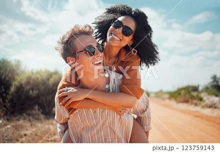 Love, happy and couple piggy back on road path in Arizona desert in USA for romantic getaway. Interracial people dating smile while enjoying summer romance on travel holiday adventure together. 123759143