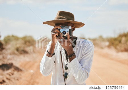 Travel, photographer and man in a desert in Australia, taking photograph of nature, beauty and earth. Countryside, photography and black man on discovery journey, traveling and enjoying the view Travel, photographer and man in a desert in Australia, taking photograph of nature, beauty and earth. Countryside, photography and black man on discovery journey, traveling and enjoying the view 123759464