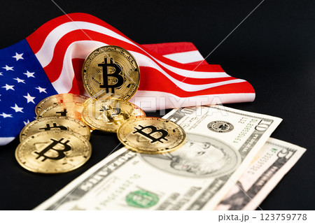Bitcoin cryptocurrency and  United States of American Flag with US dollar banknote on black. 123759778