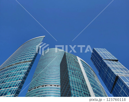 Moscow, Russia, 09:10, 2024 Background of modern architecture. The Federation skyscrapers in the Moscow City business district rise against the blue sky Moscow, Russia, 09:10, 2024 Background of modern architecture. The Federation skyscrapers in the Moscow City business district rise against the blue sky 123760118