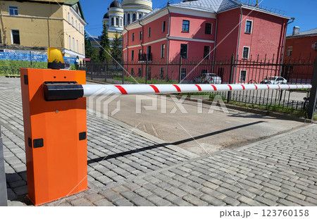 Rybinsk Russia 06 24 2024 Orange automatic barrier on a clear summer day. 123760158