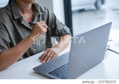 Happy cheerful cute beautiful business woman in office.  123760335