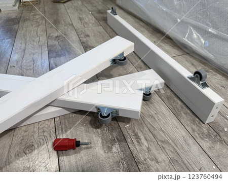 A set of elements for assembling an ottoman. 123760494