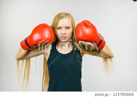 Woman in gloves playing sports boxing 123760889