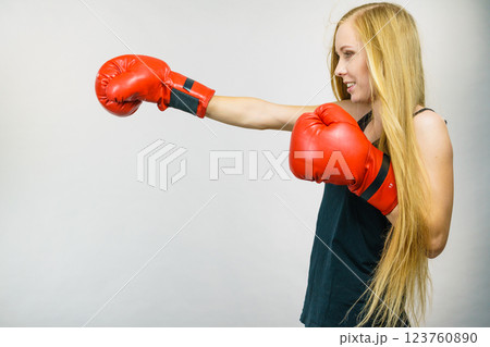 Woman in red gloves boxing 123760890