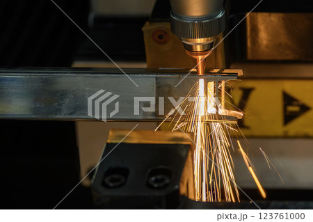 Close up scene the fiber laser cutting machine cut the square shape stainless steel tube with sparkling light. Close up scene the fiber laser cutting machine cut the square shape stainless steel tube with sparkling light. 123761000