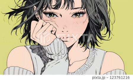 唇を噛んで不安そうな表情をしている若い女性