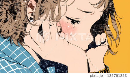 唇を噛んで不安そうな表情をしている若い女性
