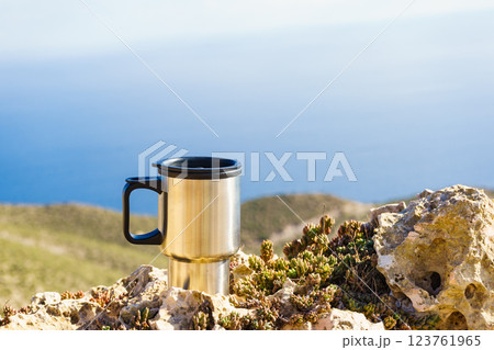Thermal mug, thermos on nature. Travel outdoor picnic. Thermal mug, thermos on nature. Travel outdoor picnic. 123761965