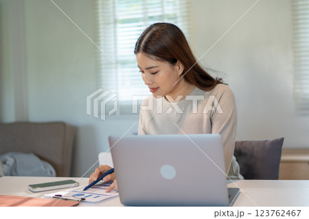 Lovely mom and little young daughter spending time together in their living room. Lovely mom and little young daughter spending time together in their living room. 123762467