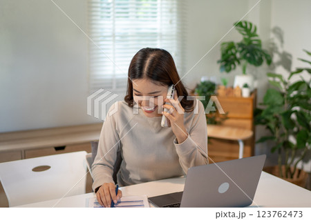 Lovely mom and little young daughter spending time together in their living room. Lovely mom and little young daughter spending time together in their living room. 123762473