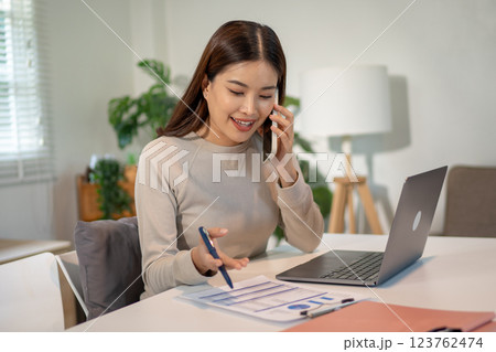 Lovely mom and little young daughter spending time together in their living room. Lovely mom and little young daughter spending time together in their living room. 123762474