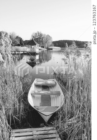 A small boat on the shore of a lake, Barlinek, Poland. 123763167