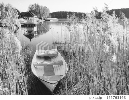A small fishing boat on the shore of a lake, Barlinek, Poland. 123763168